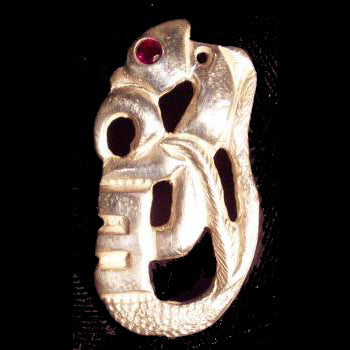 Manaia bone carving made of Art Clay Silver with a Ruby eye